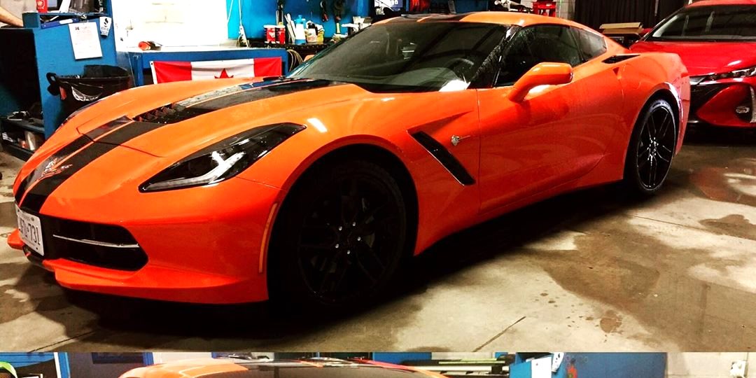 Orange performance coupe with tinted glass completed in the Skyline Reflections shop