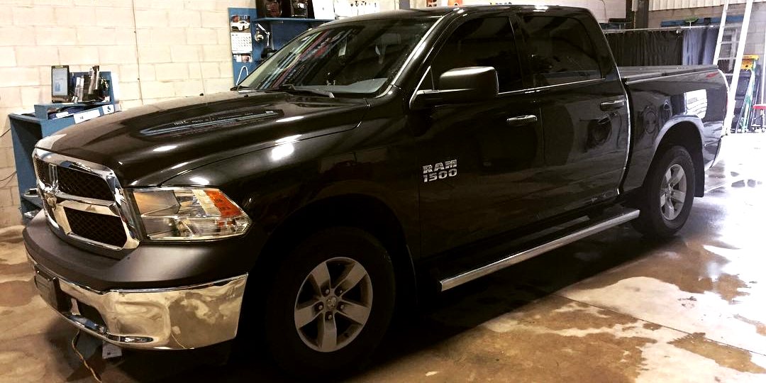 Black pickup truck with tinted side glass completed in the Skyline Reflections shop