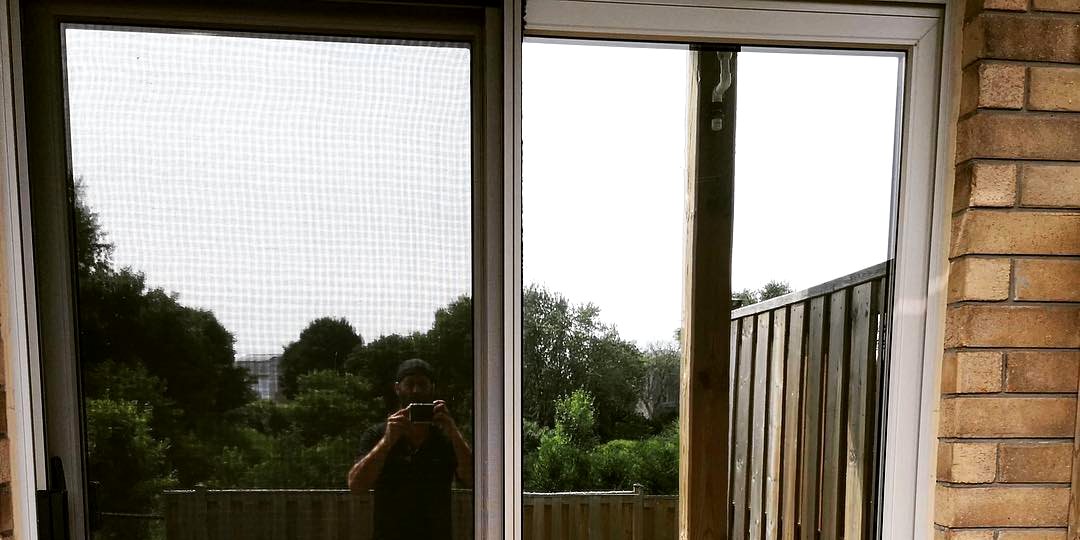 Patio sliding door with film installed, viewed from inside toward the garden