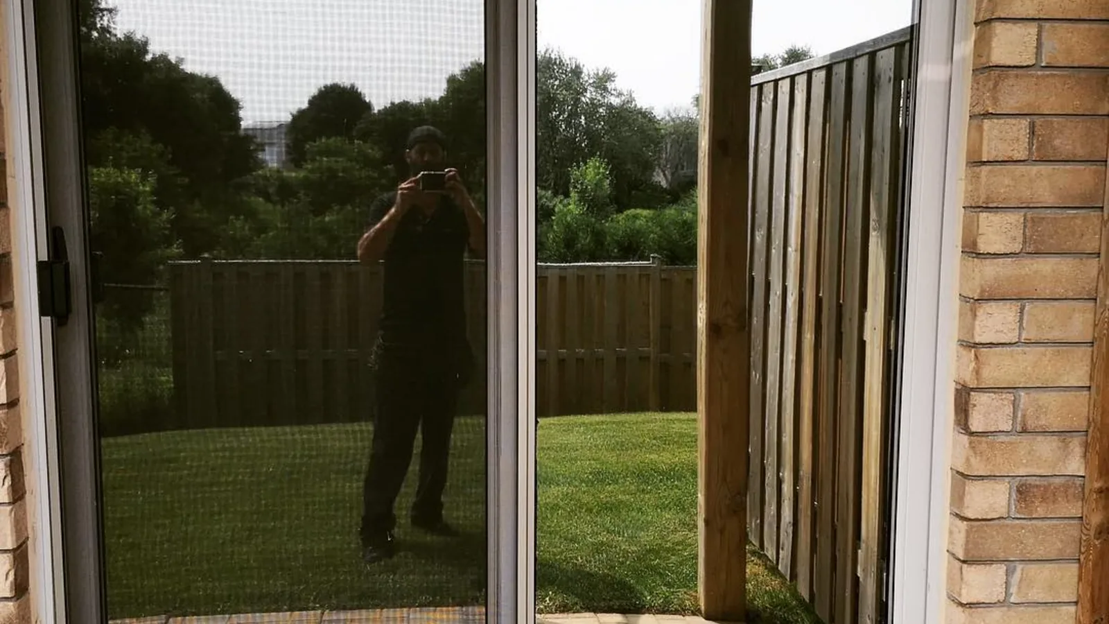 Residential glazed door and window after film installation, seen from inside the room