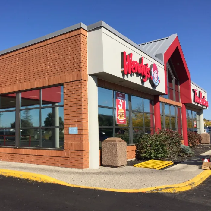 Commercial storefront exterior with large filmed glazing